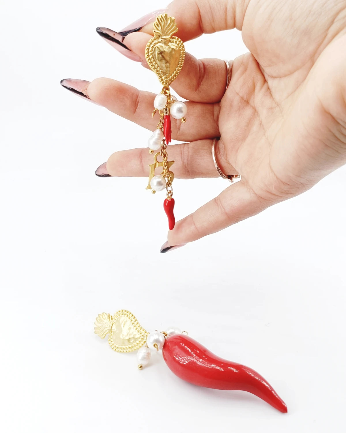 Orecchini Corno e cuori sacri