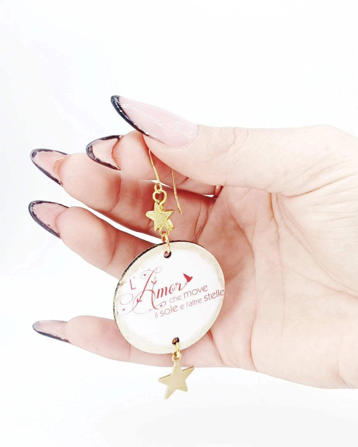 Orecchini di carta L'amor che move il sole su mano