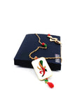 collana asso di bastoni su scatola