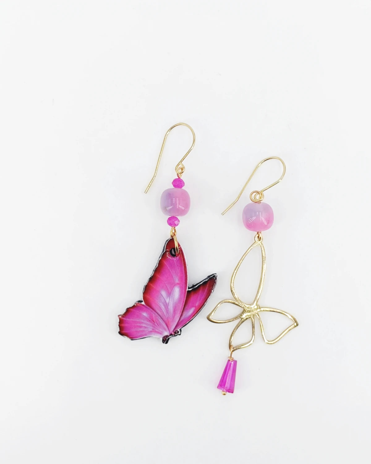 orecchini di cara farfalle fucsia
