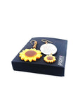 orecchini girasole su scatola